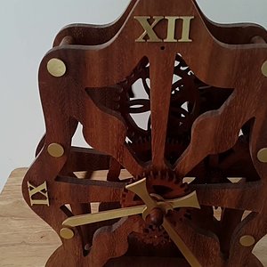 Wooden clock with non-circular gears and electromagnetic pendulum